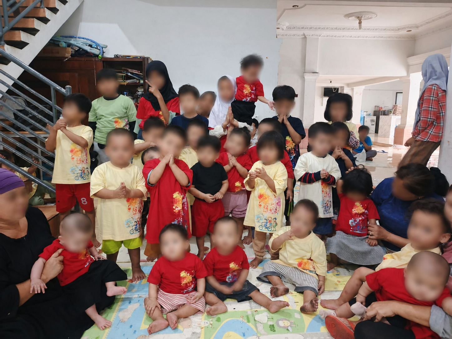 Children gathered during CNA Konveksi's community clothing donation